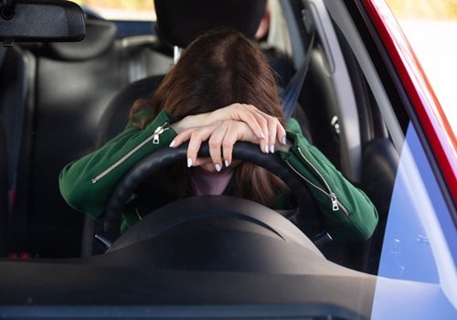 woman-sleeping-inside-car.jpg